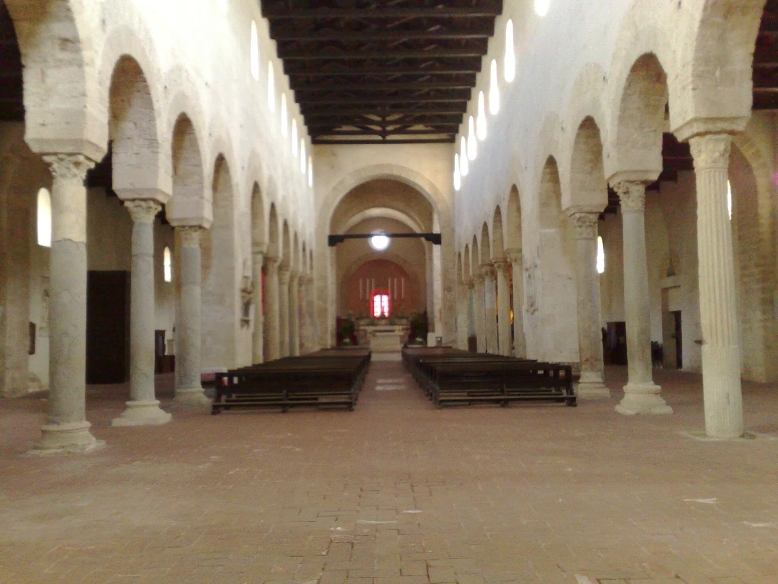 Gerace Cathedral nave with Romanesque arches and wooden ceiling