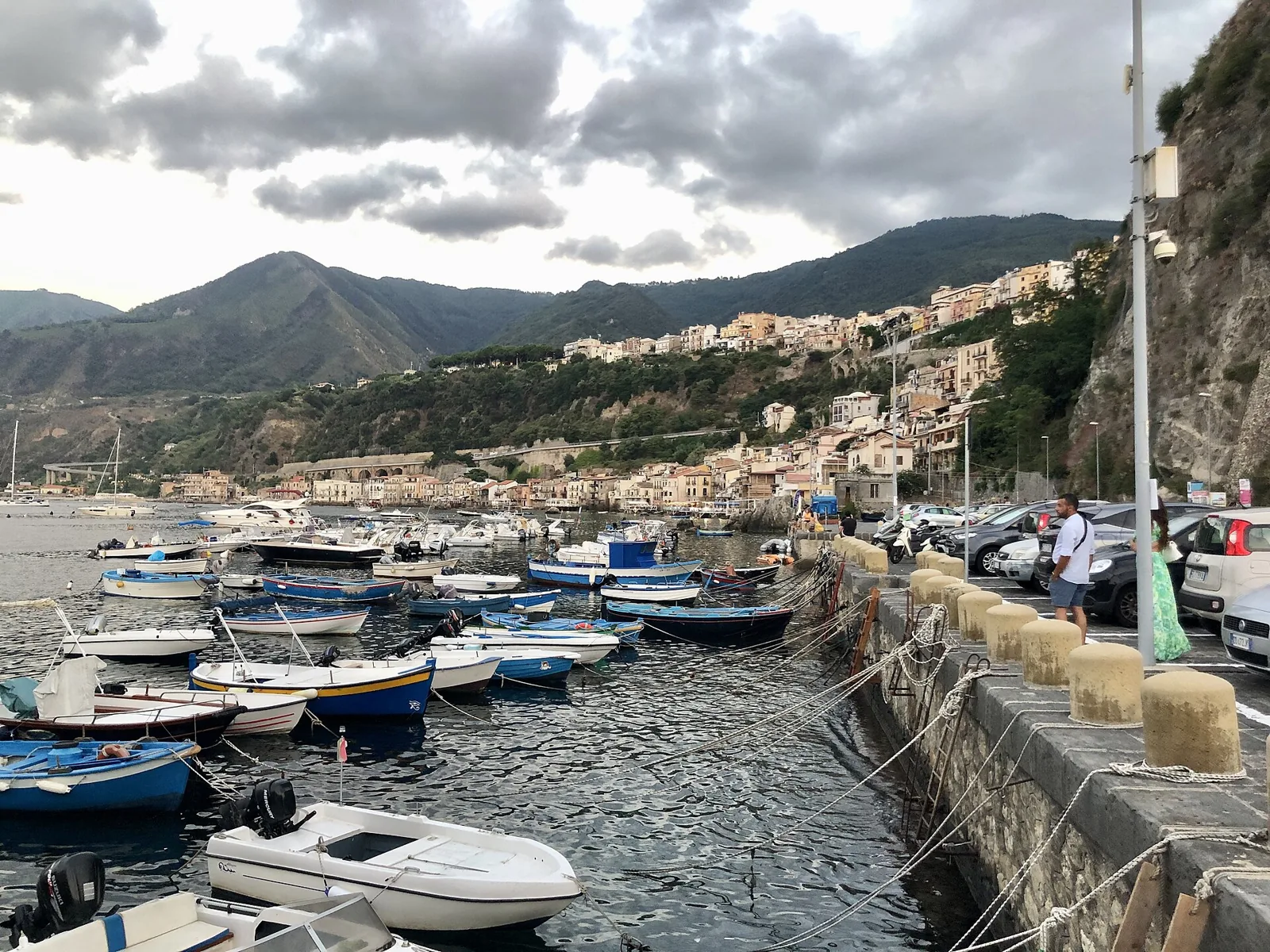 Scilla harbor with boats and Chianalea hillside homes